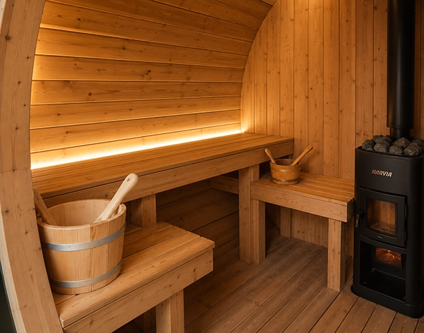 Warm timber interior inside a barrel sauna